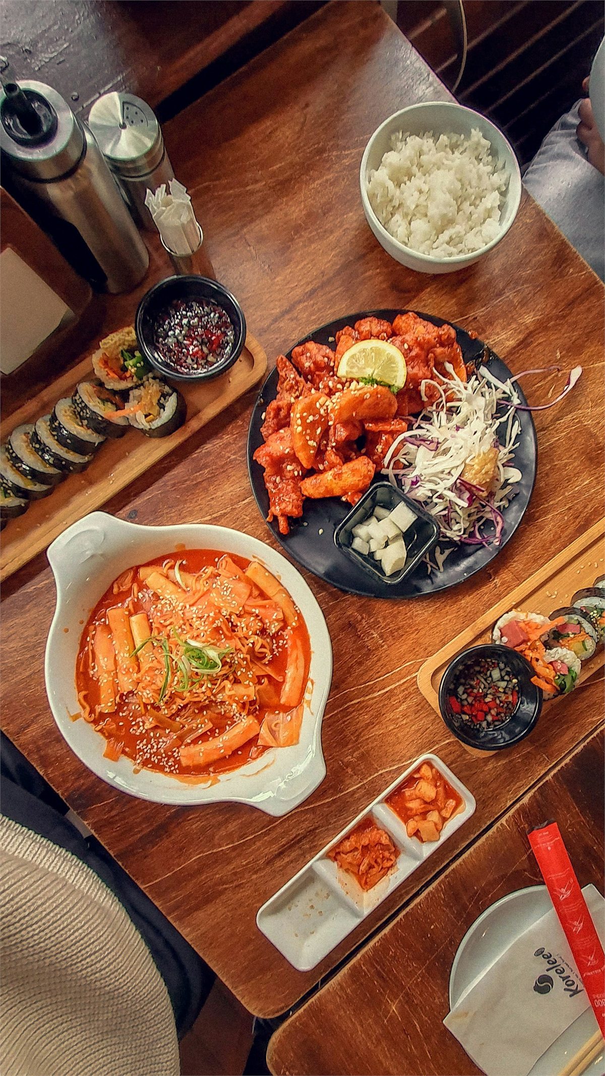 Tteokbokki, gimbap, and Korean fried chicken on a table